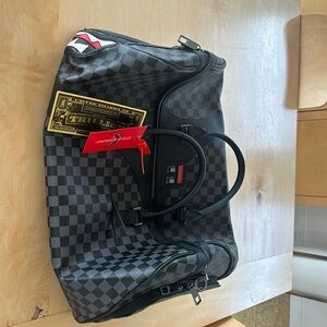 Sprayground duffle bag.